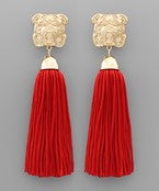 Red tassel earrings with a golden bulldog.
