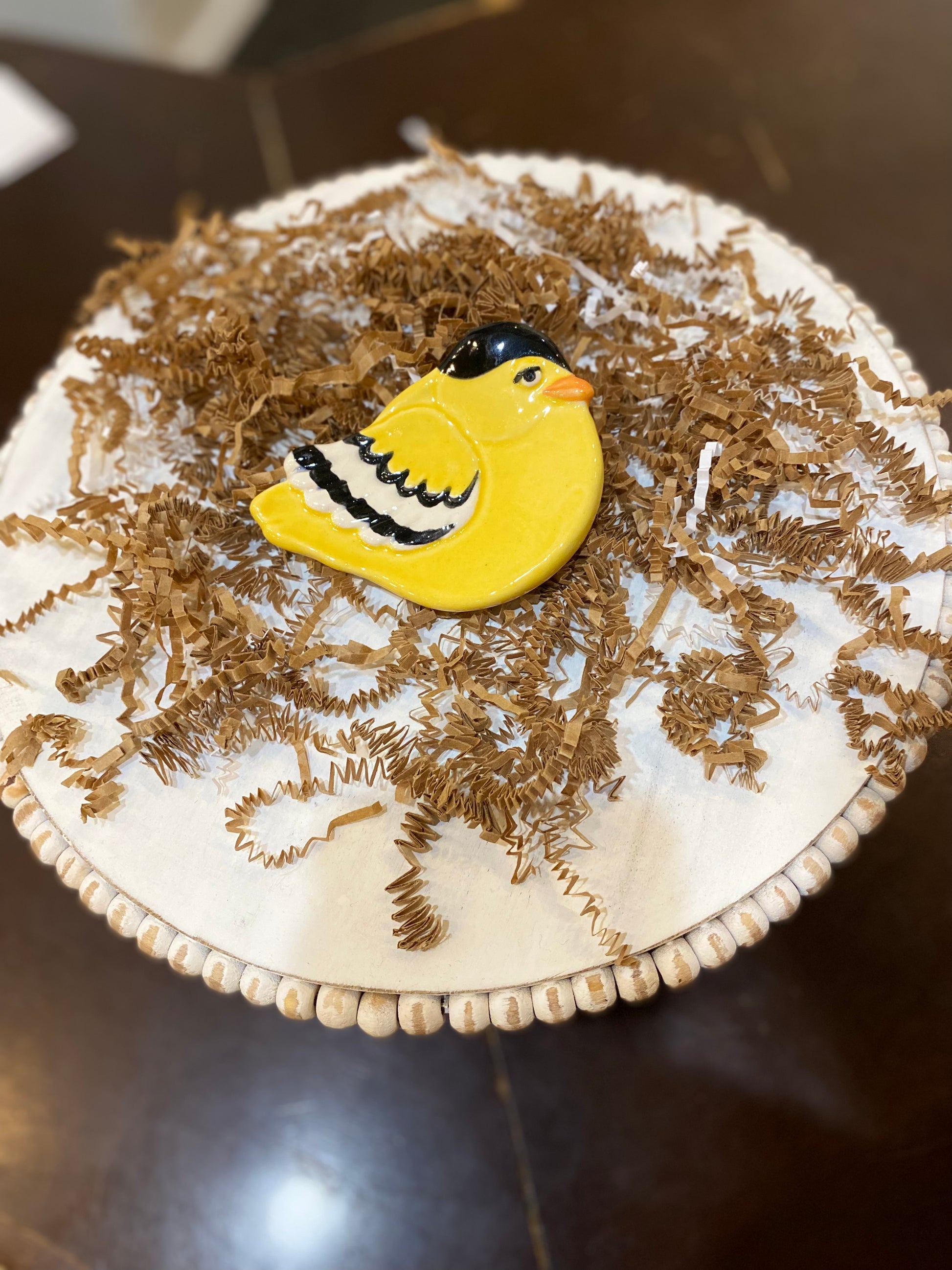 Small handmade yellow bird ceramic dish.