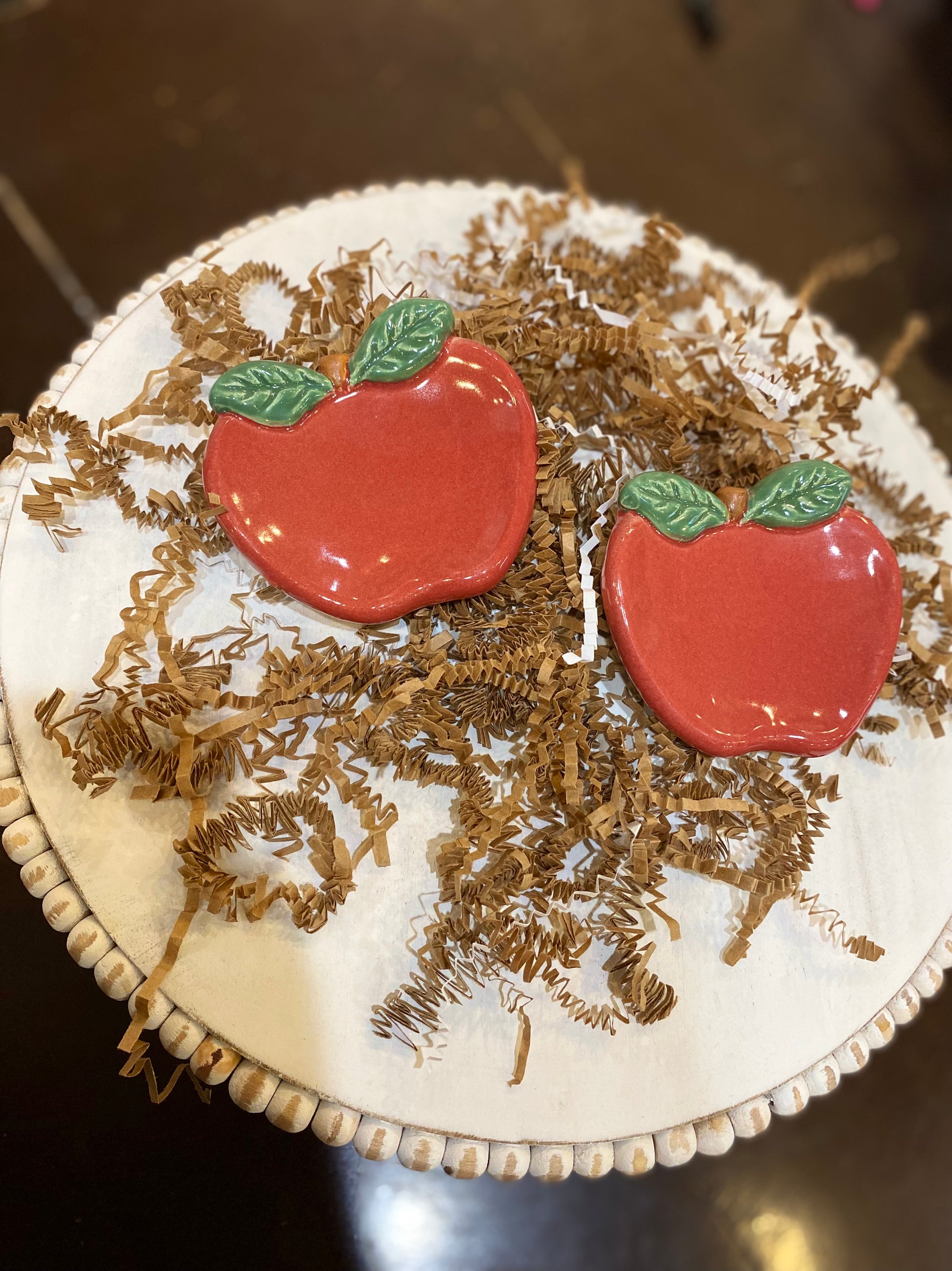 Small handmade apple ceramic dishes.