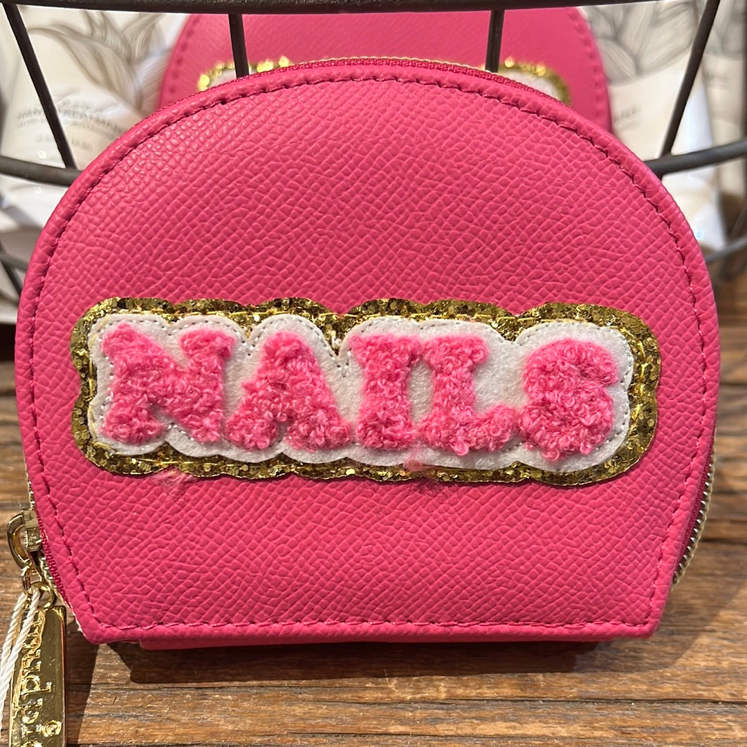 Hot pink manicure kit featuring "NAILS" in fuzzy lettering.