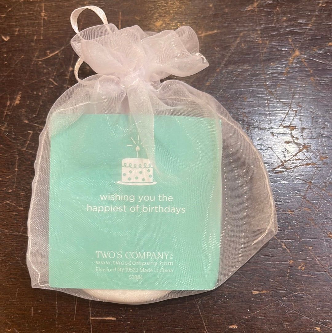 Back of birthday wish token in small drawstring giftbag that says "wishing you the happiest of days".