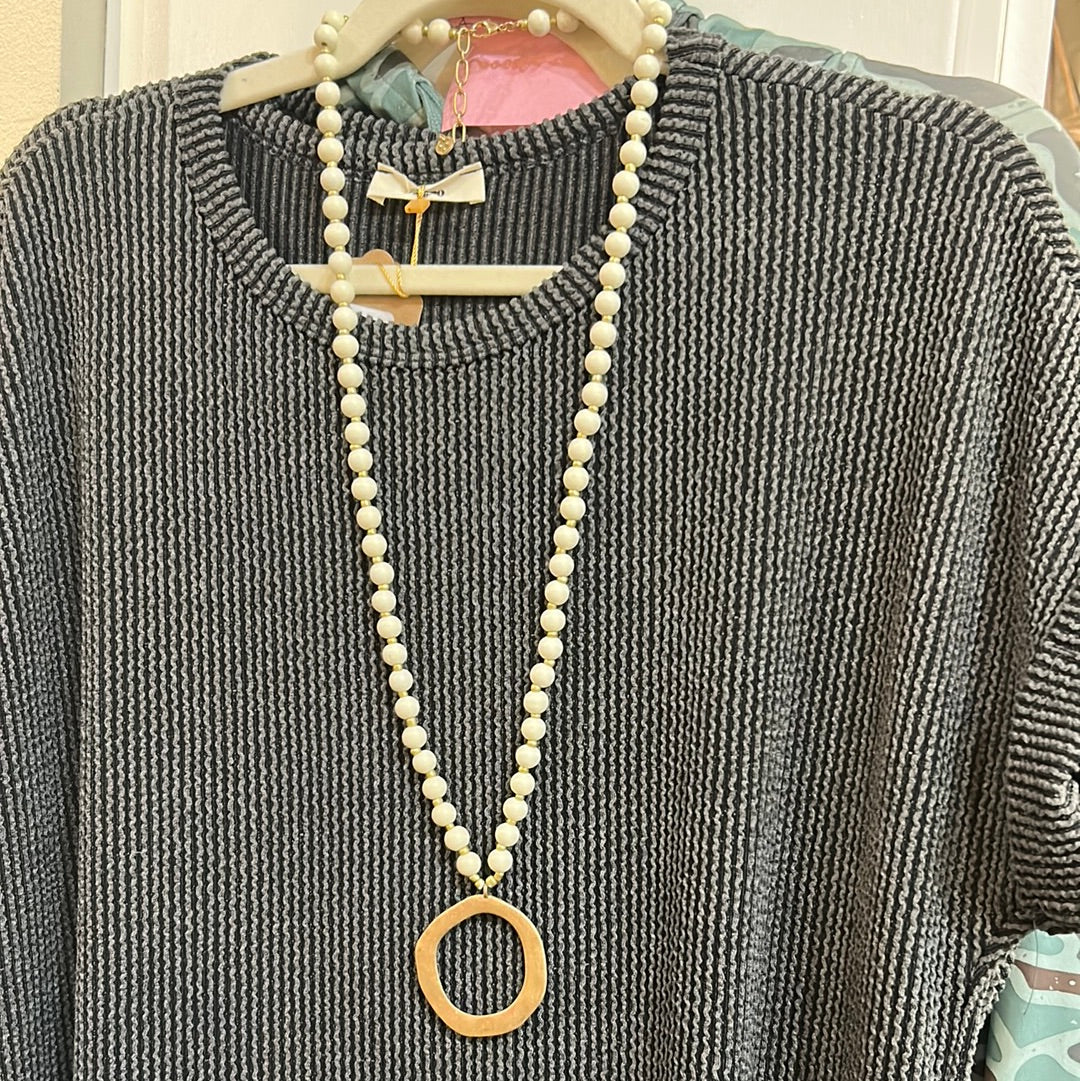 White Wood Beaded Necklace with Golden round Charm.