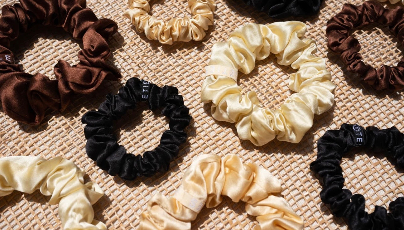 Assorted teletie silk scrunchies.