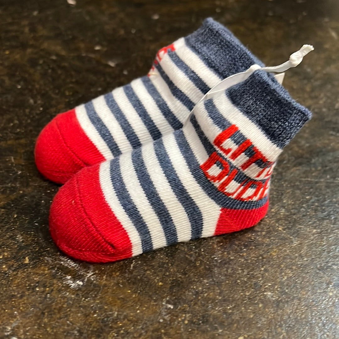 Blue striped baby socks with red toes that say "Little Dude".