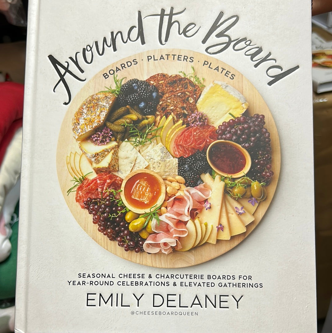 White book featuring a charcuterie board with "Around the Board" in black lettering.
