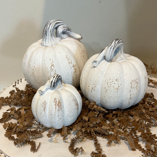 Three set of white resin mini pumpkins.