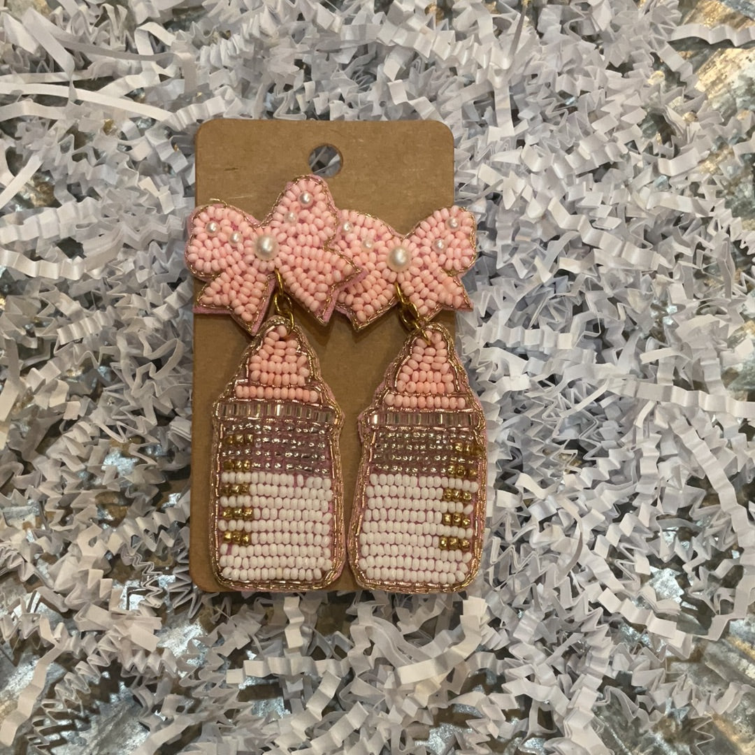Beaded pink baby bottle earrings with pink beaded bows.