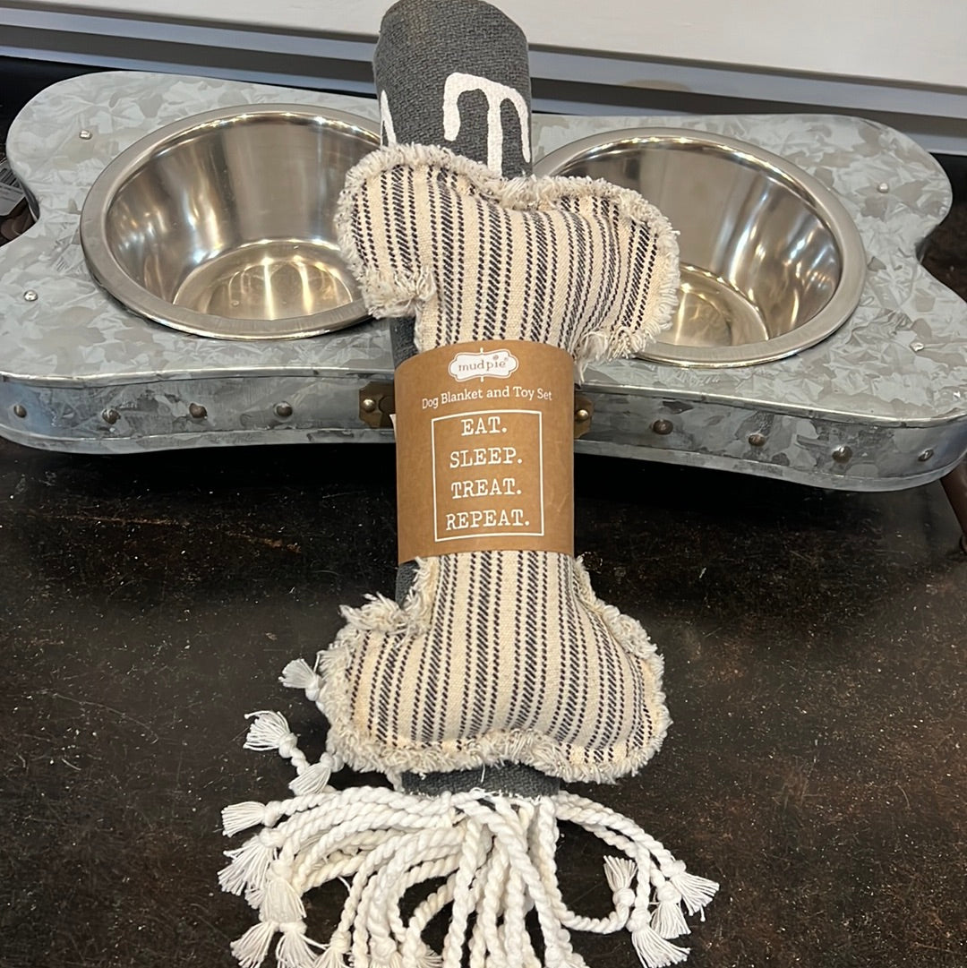 Canvas dog blanket featuring "EAT. SLEEP. TREAT. REPEAT" with a canvas dog bone toy.