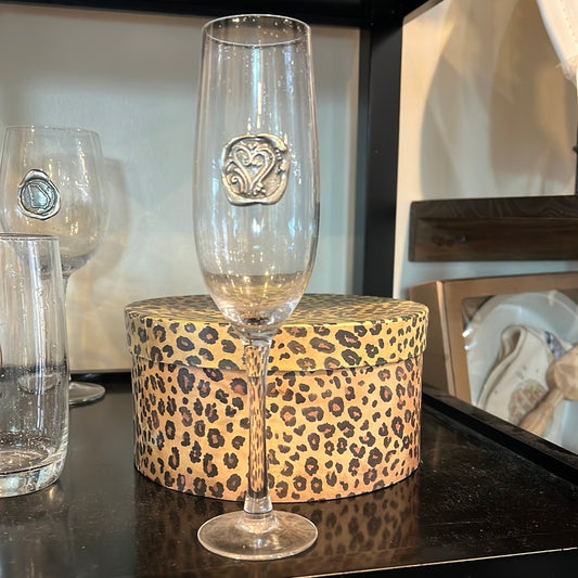 Hand blown drinking glass with custom pewter hearts stamp.