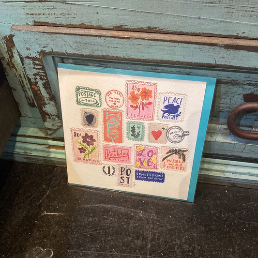 Card featuring collection of vintage and colorful postage stamps.