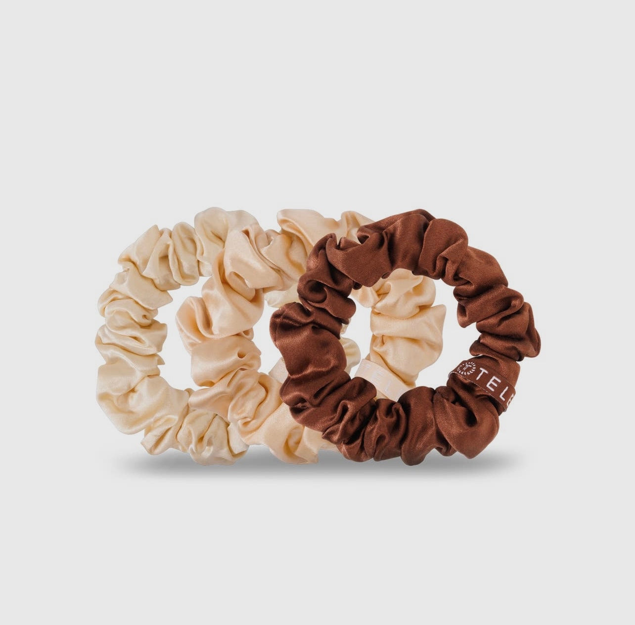 Neutral teletie silk scrunchies.