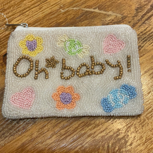 White beaded coin purse with different colored flowers and "Oh baby!" in golden beading.