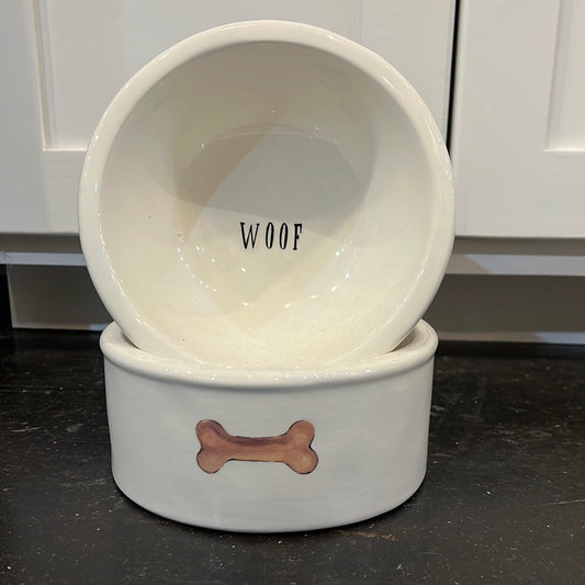 White ceramic dog food bowls featuring "woof" & a bone.