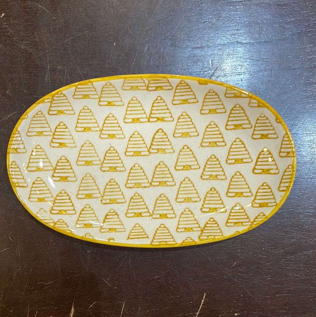 Hand stamped stoneware plate with a golden bee hive design.