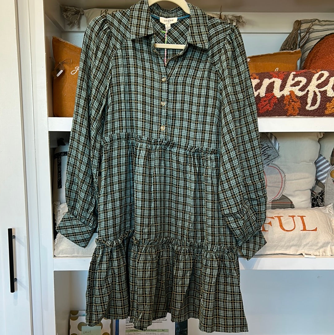 Teal colored flannel plaid tiered dress with long sleeves.