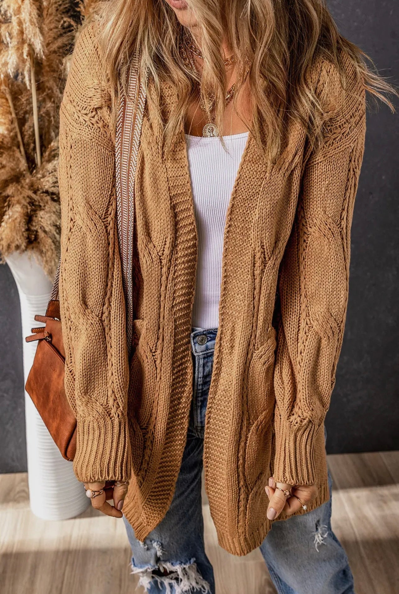 Model featuring camel knitted long cardigan.