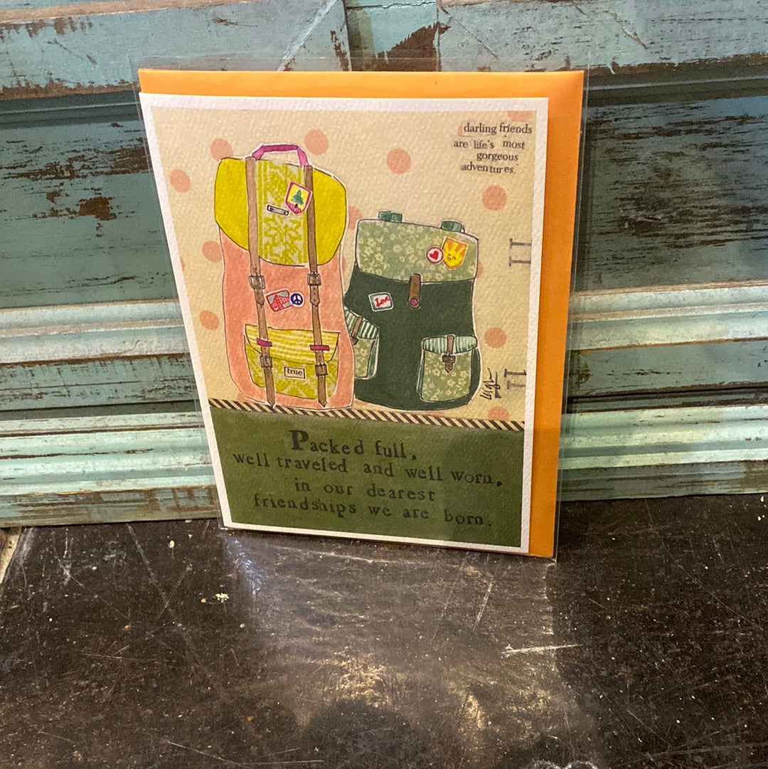 Card with luggage displaying "Packed full, well traveled and well worn, in our dearest friendships we are born."