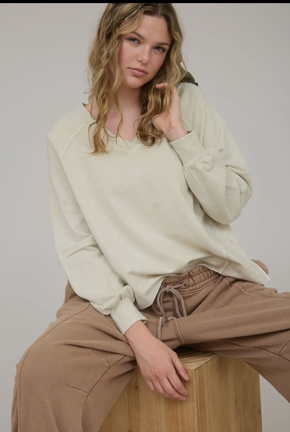 Washed V Neck Exposed Seam Long Sleeve Knit Top