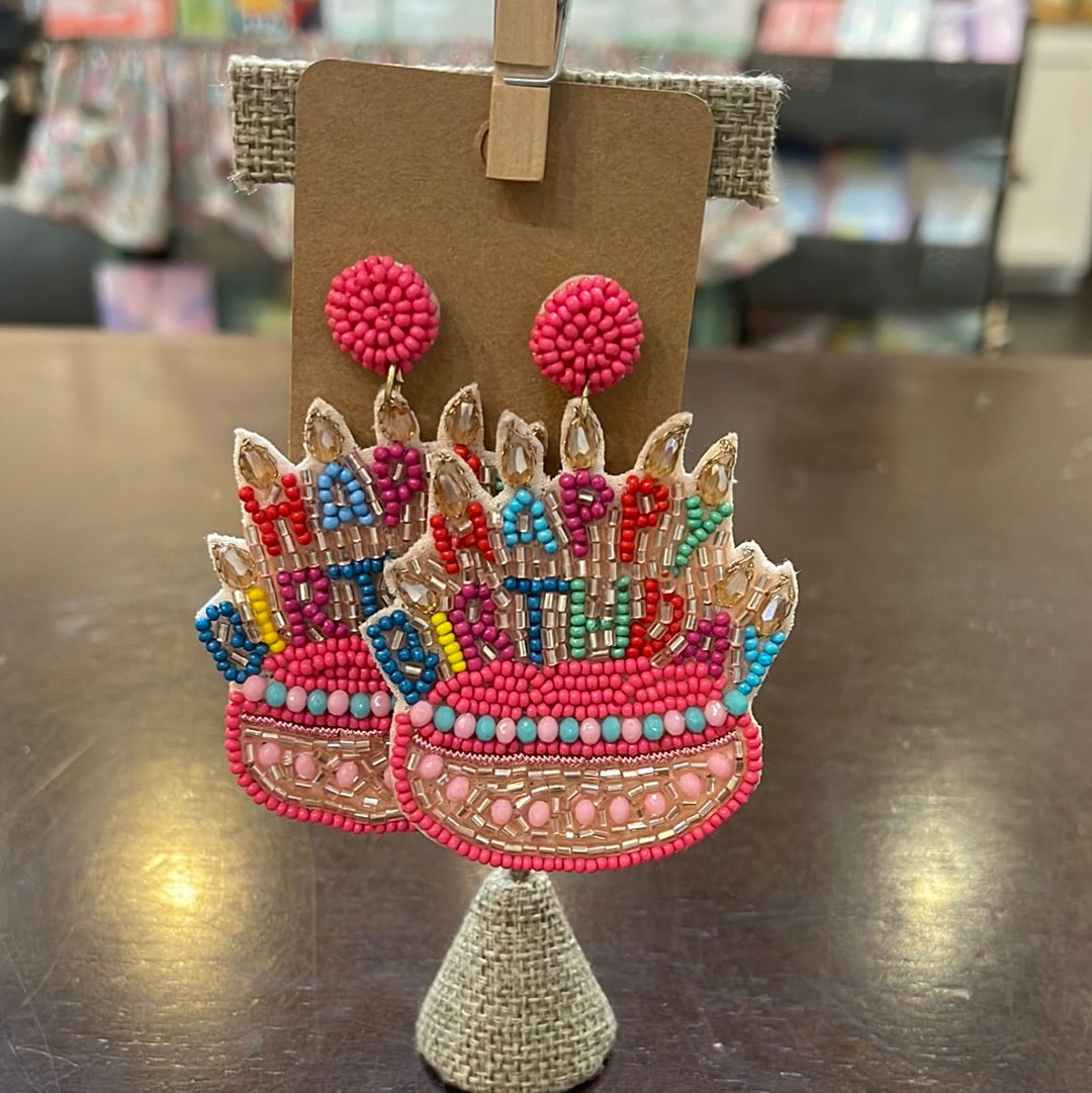Beaded pink birthday cake earrings with multicolored beads.