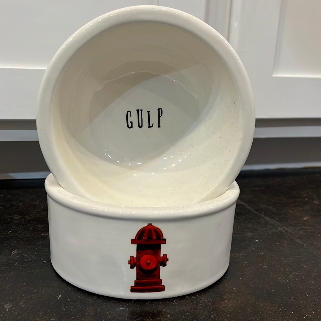 White ceramic dog food bowls featuring "gulp" & a fire hydrant.