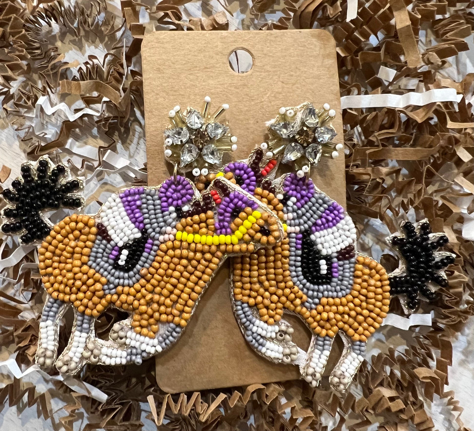 Multicolored race horse earrings.