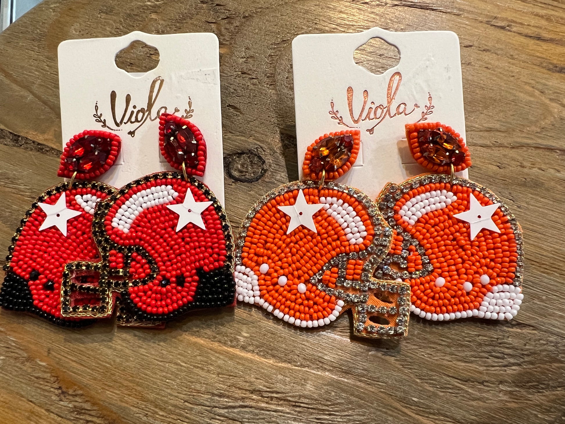 Assorted sports helmet beaded earrings.
