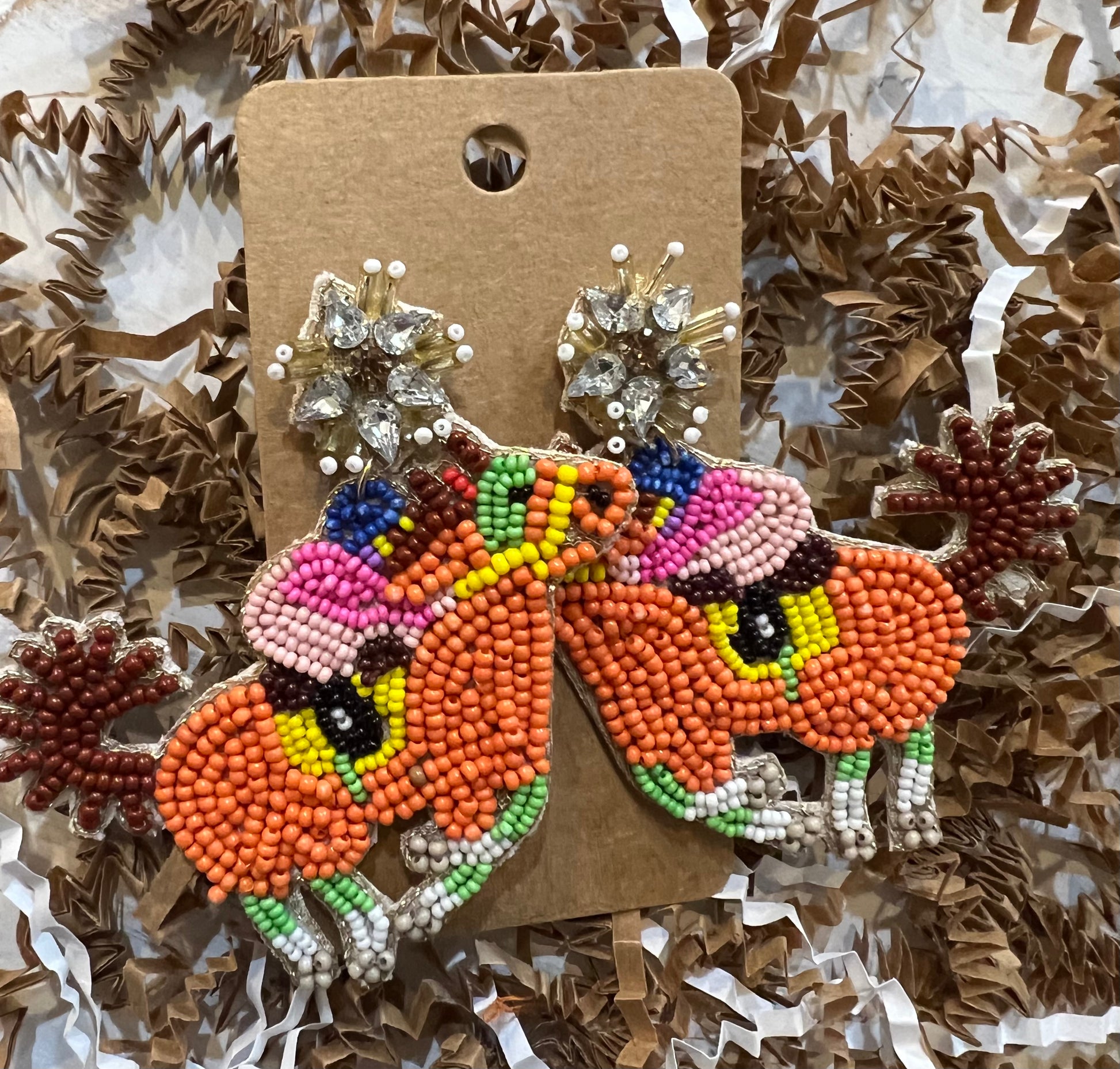 Multicolored race horse earrings.