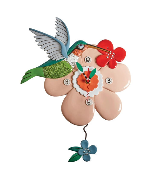 Clock shaped like a pink flower with a hummingbird.