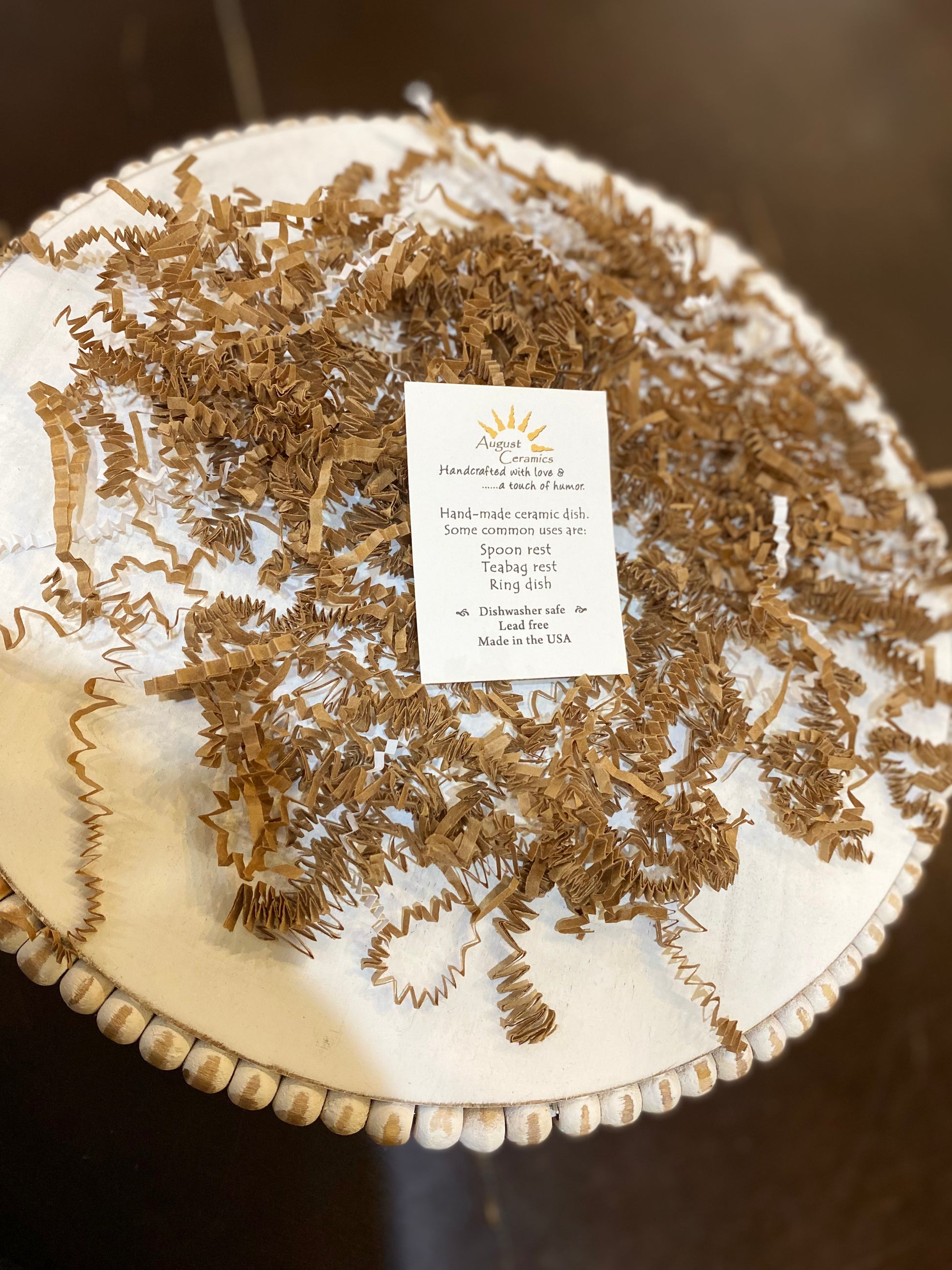 Note card with information about handmade ceramic dishes.