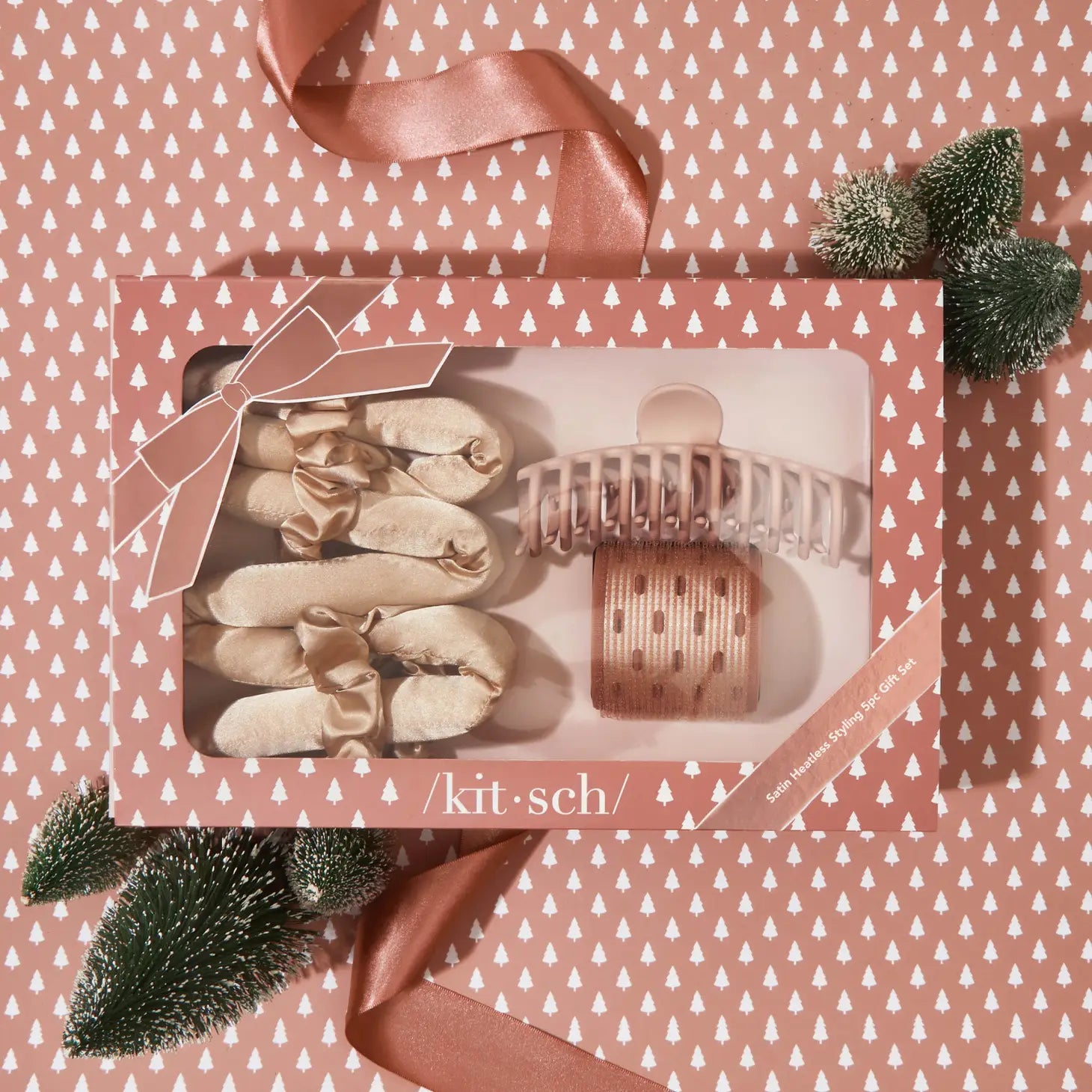 Kitsch hair accessories set in pink packaging.