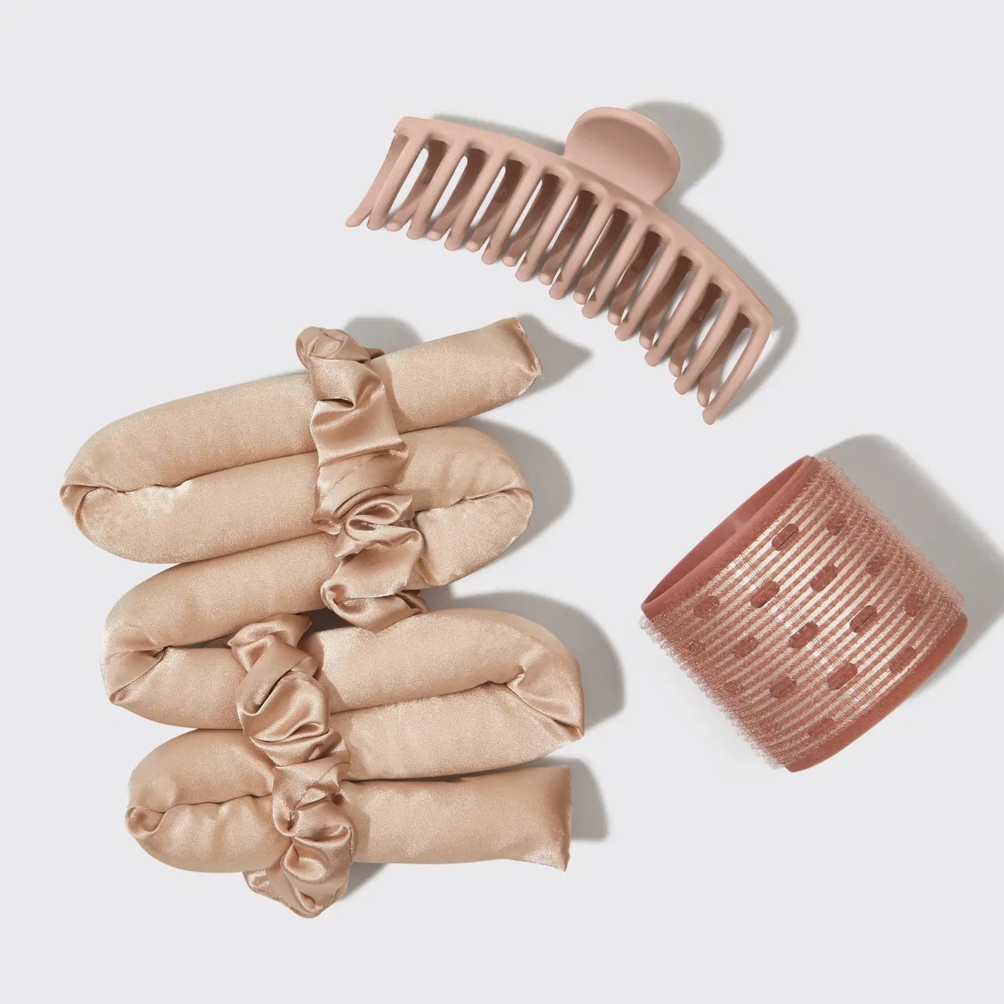 Kitsch hair accessories featuring heatless curler, claw clip and hair tie.