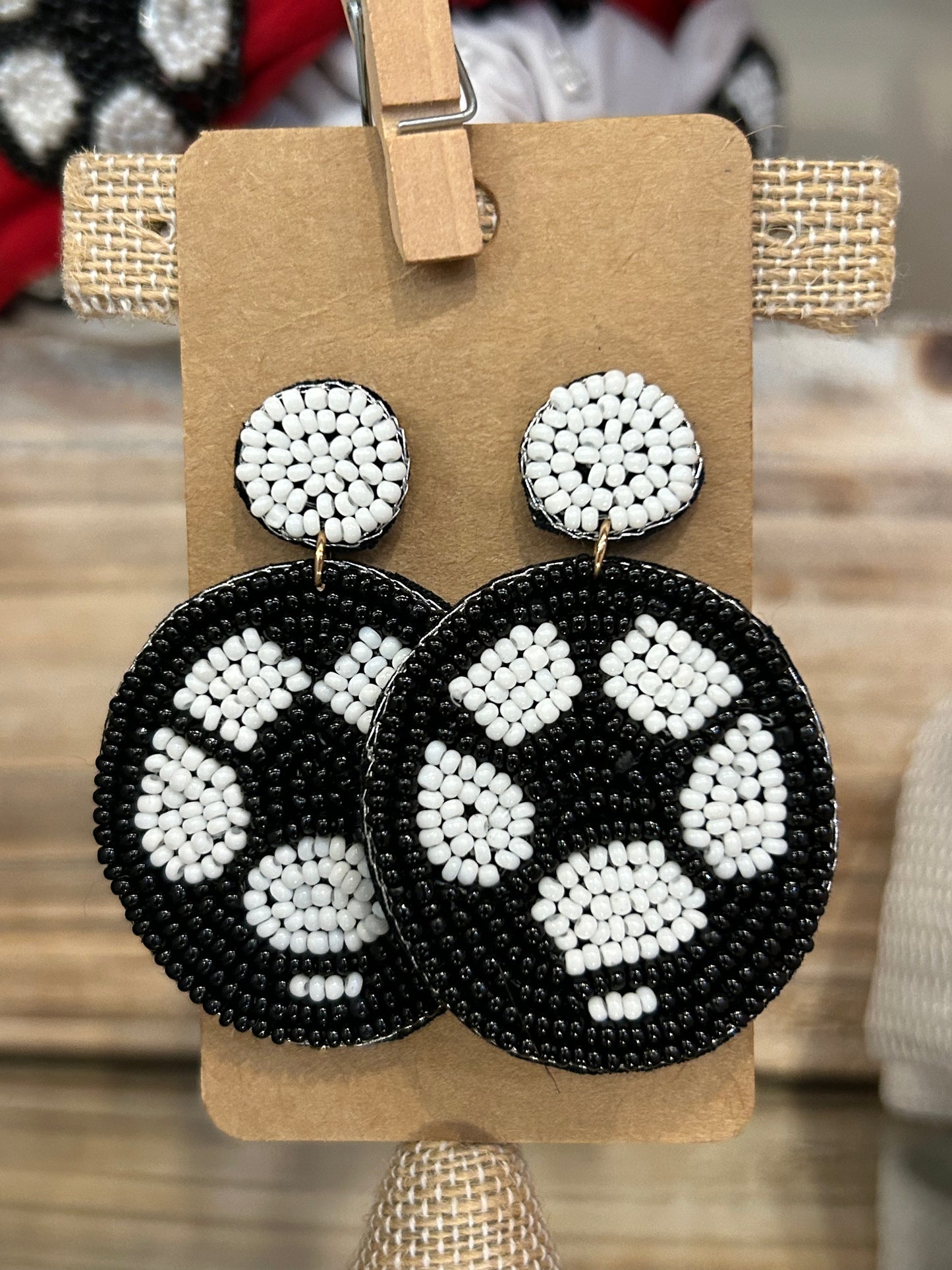 Beaded dangling soccer earrings with white beaded stud.