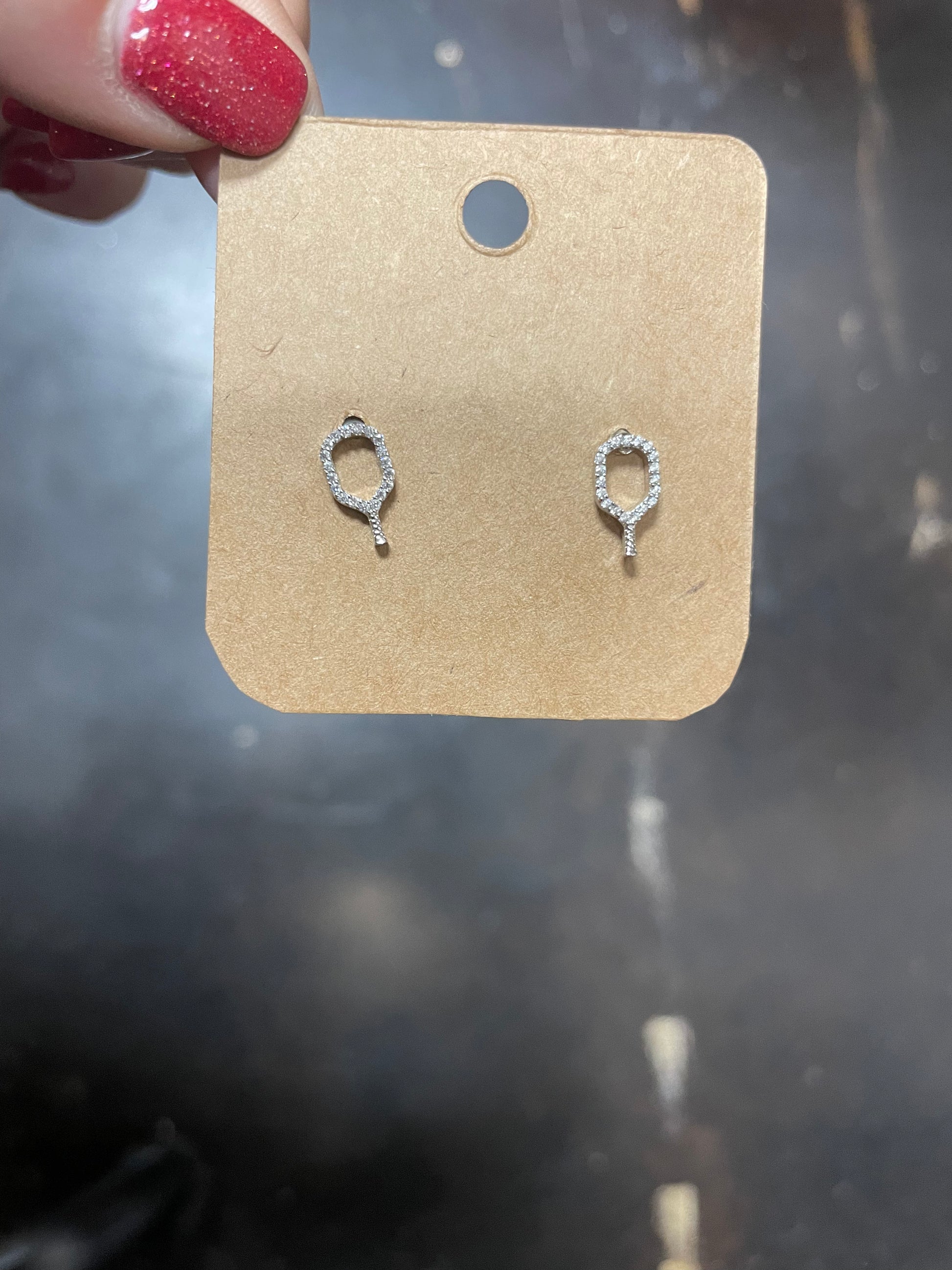 Rhodium pickleball stud earrings.