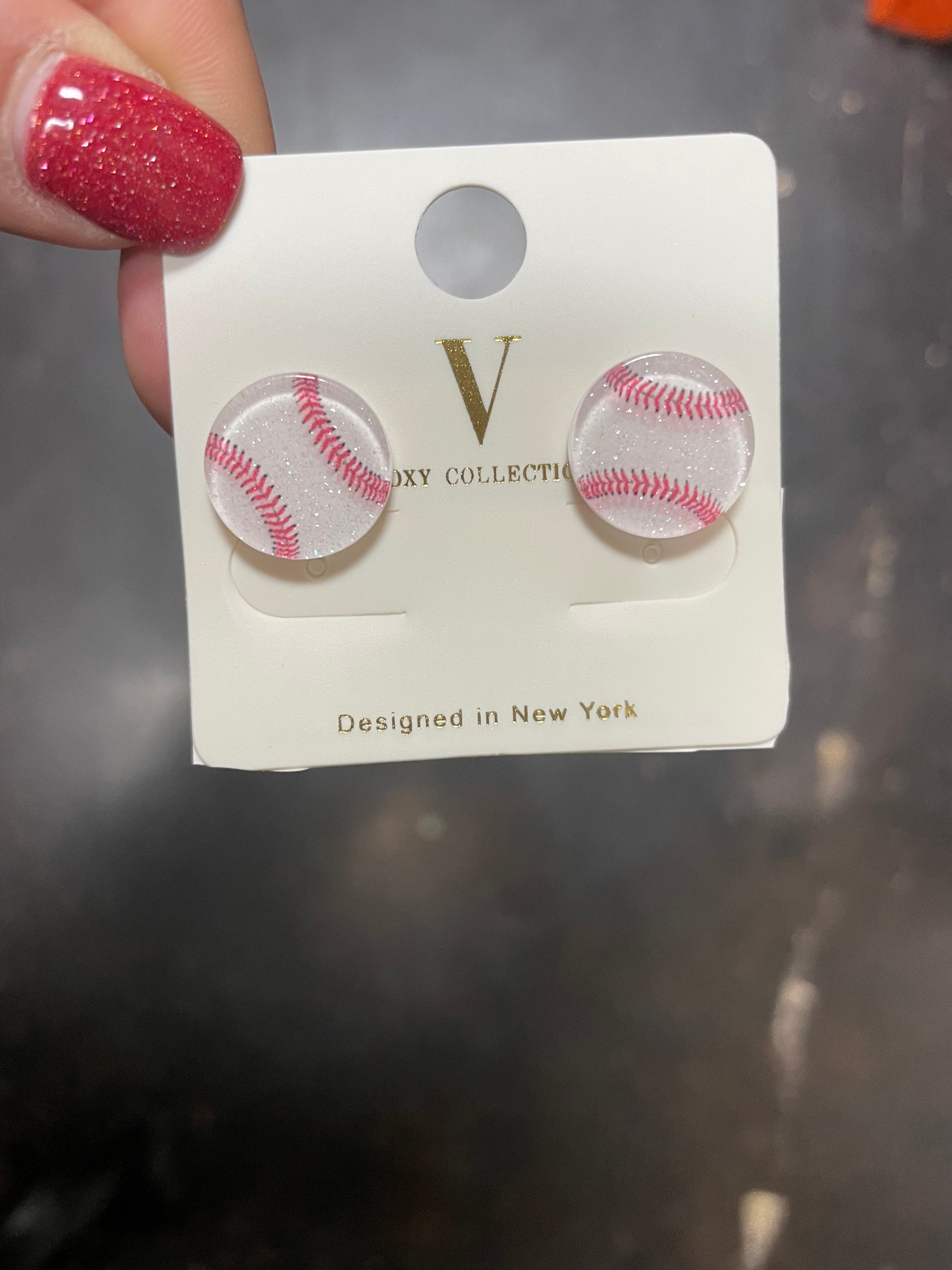 Baseball stud earrings.