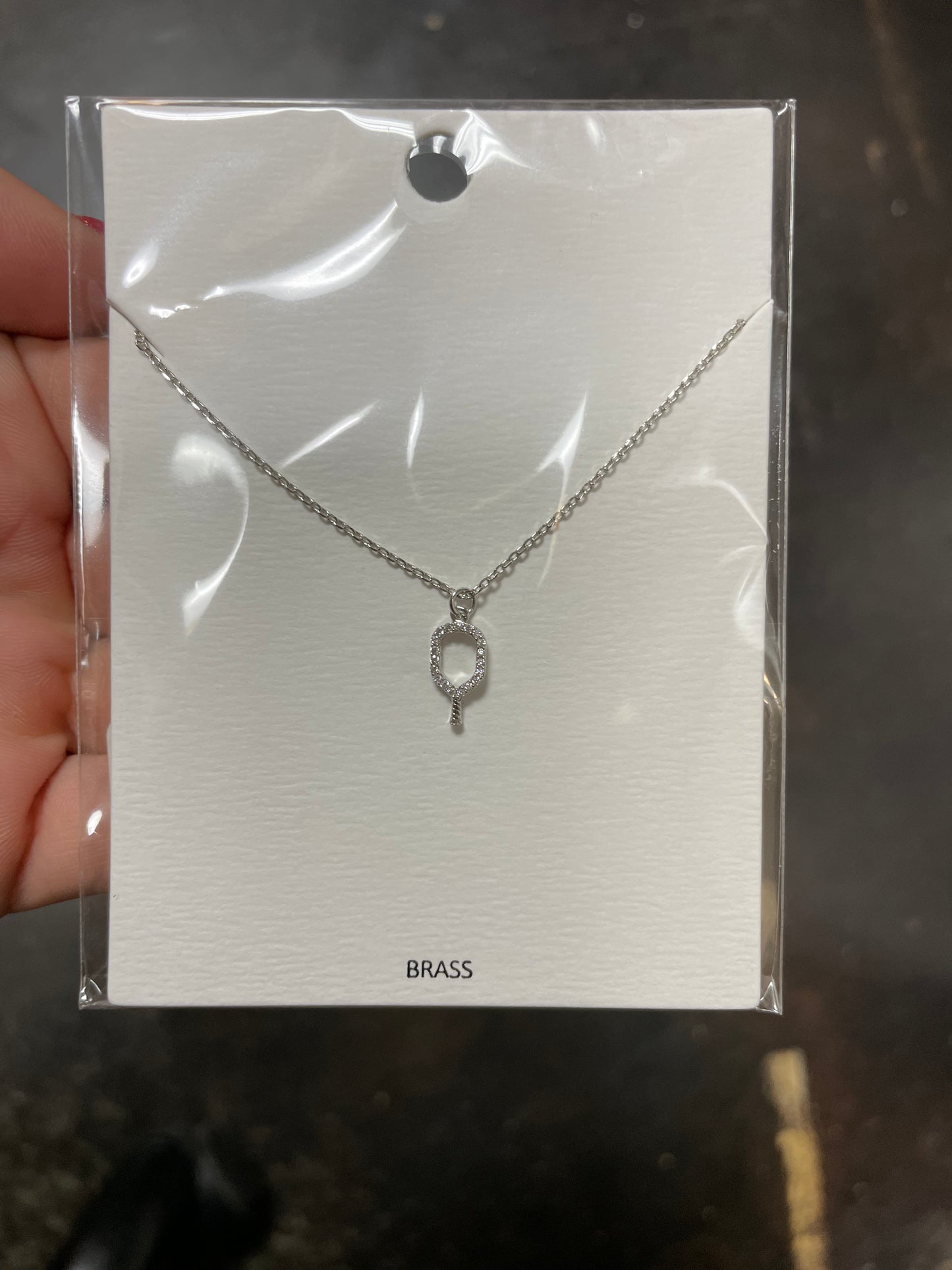 Rhodium Pave Outline Pickleball Pendant Necklace.