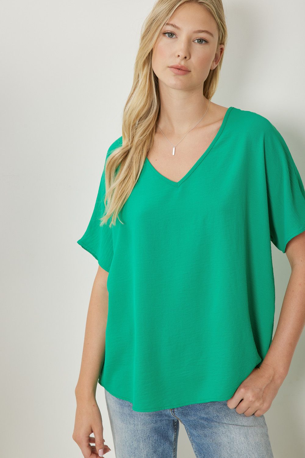 Women's green basic v-neck shirt.
