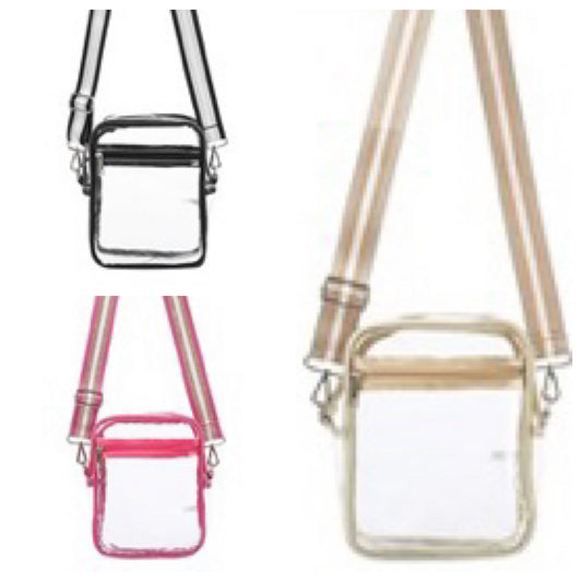 Assorted clear bag with zipper pocket and striped strap.