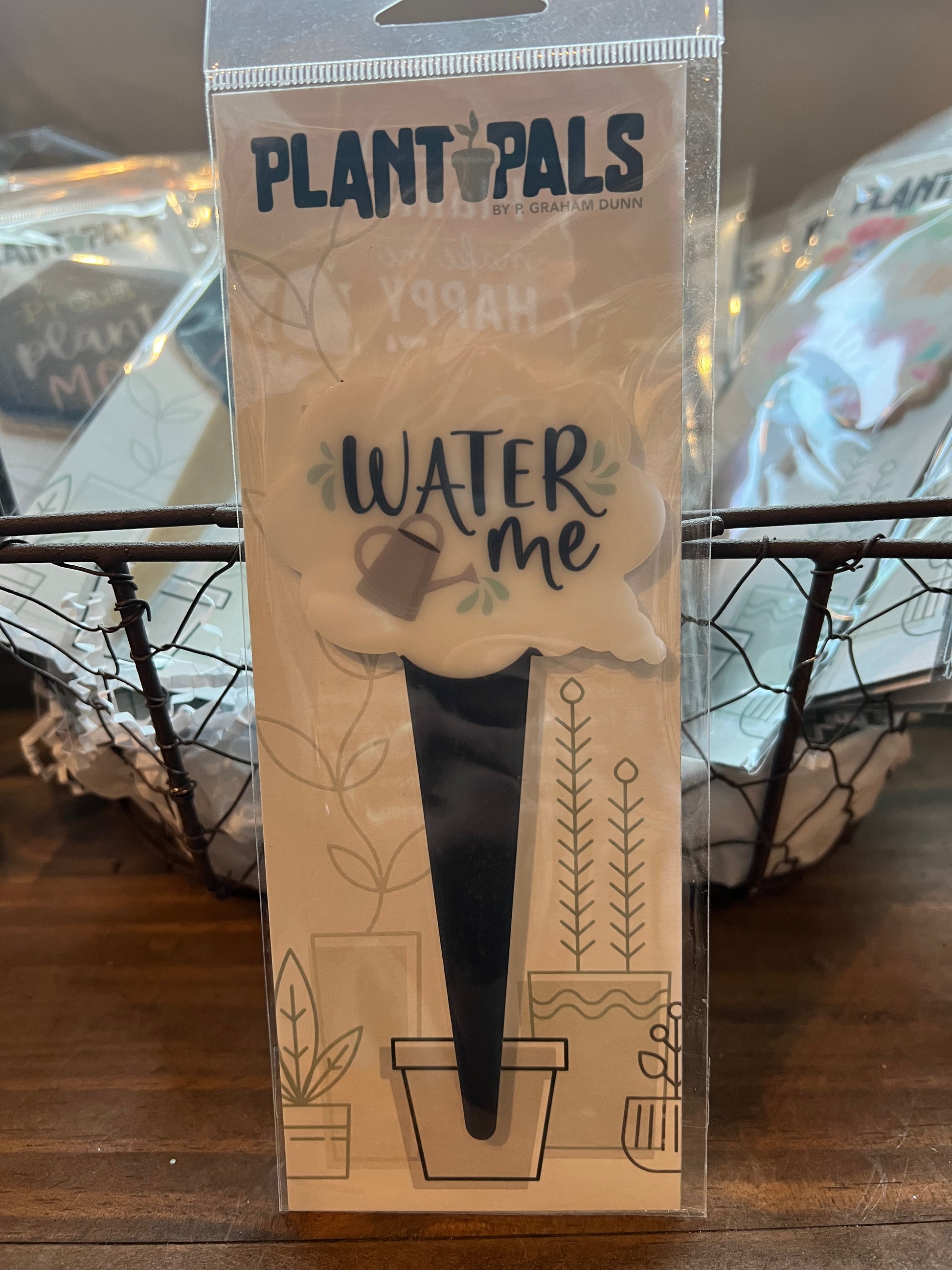 Watering can "Water Me" plant pal sign.