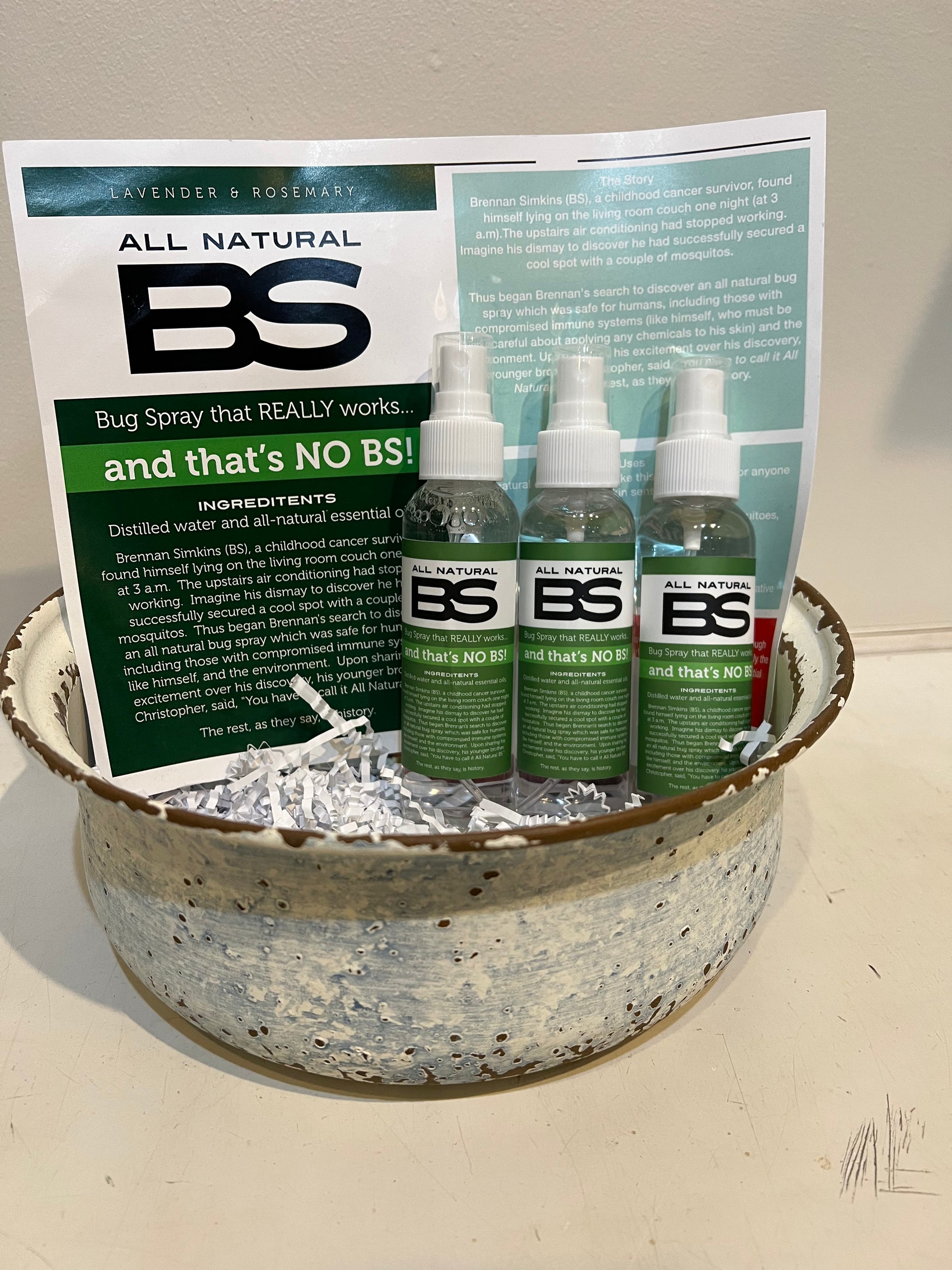 Spray bottle is clear with a green label featuring "BS".