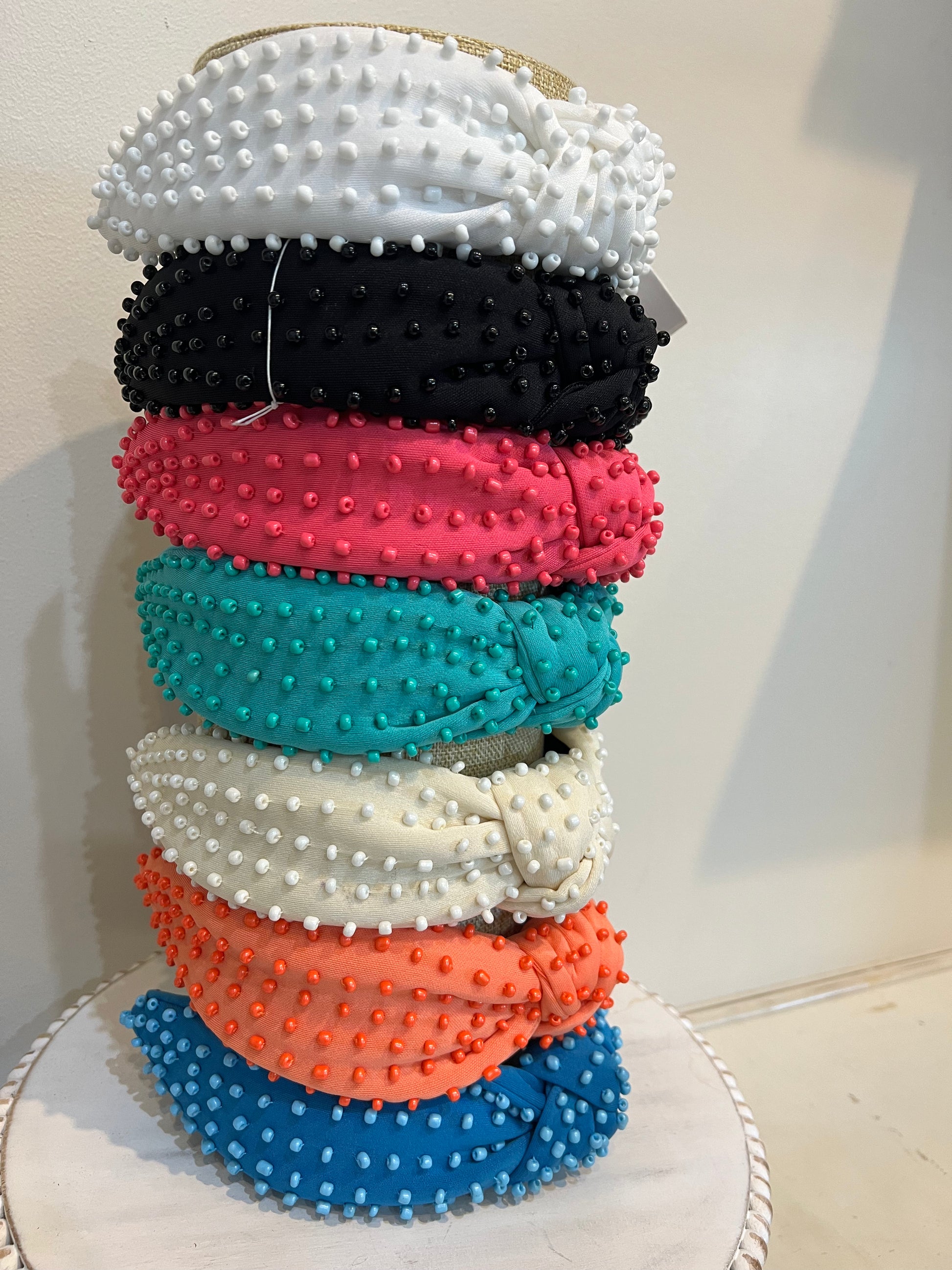 Assorted top knot headbands with beads.