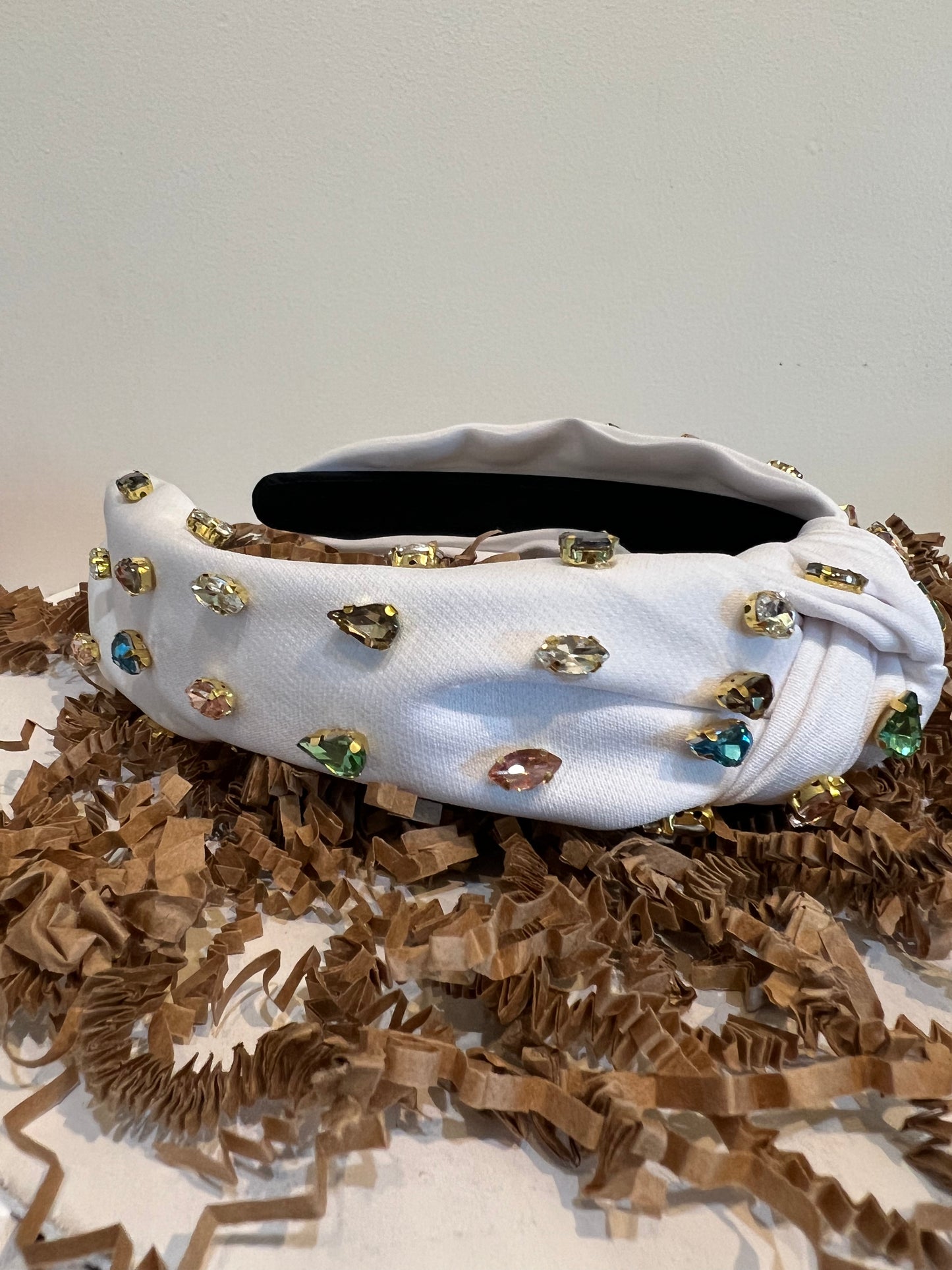 White multicolor jeweled headband.