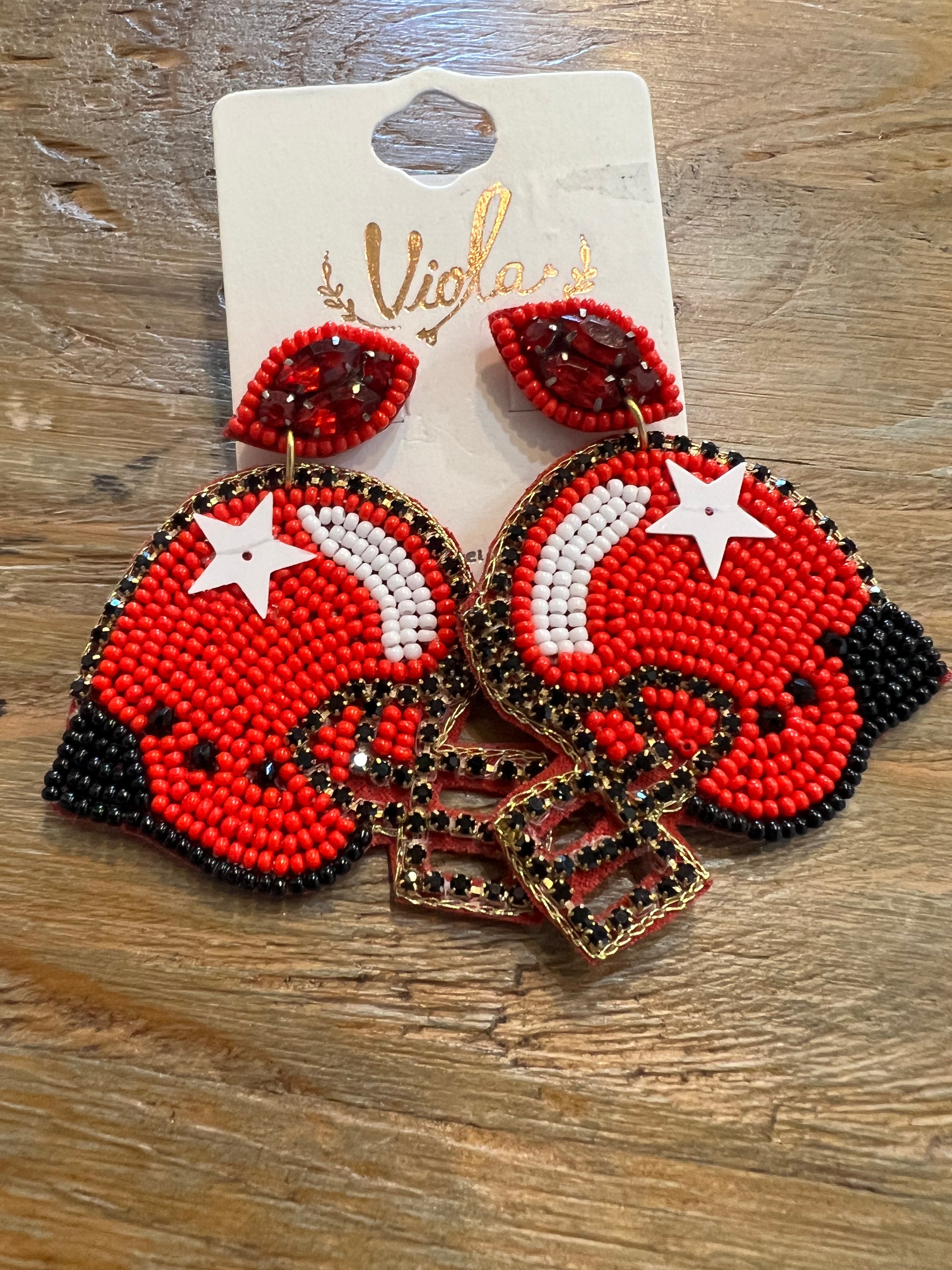 Red and black beaded sports helmet earrings.