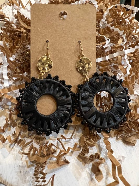 Black round threaded earrings with beads.