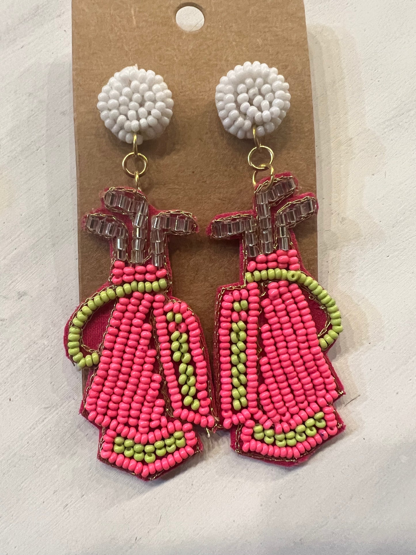Neon pink slim golf bag beaded earrings.