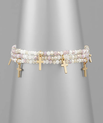 Beaded Ivory colored cross bracelet with cross charms.