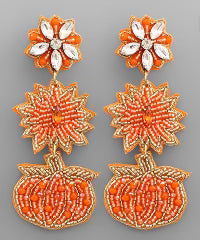 3 tiered dangle beaded earrings with a beaded pumpkin attached to a beaded flower attached to a jeweled flower.