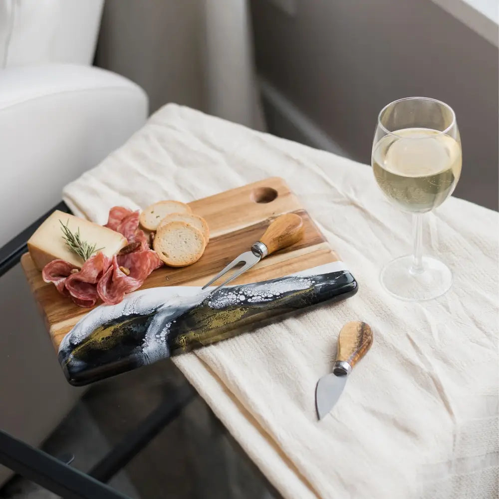 Square black, white, and gold marble dipped board.