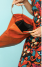 Rust orange Metal Handle Folded Clutch.