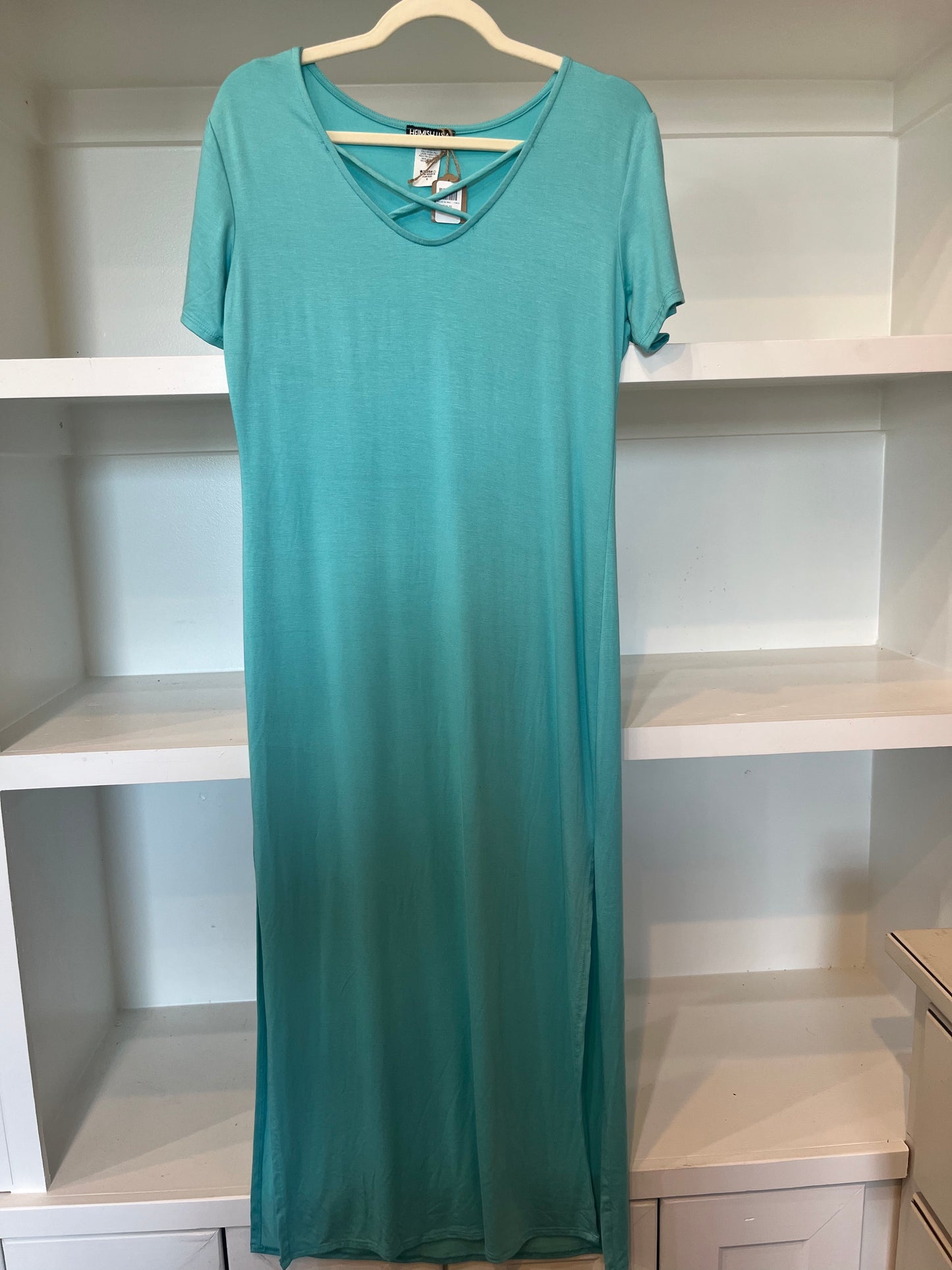Mint colored short sleeve maxi dress with crisscross detail on collar.