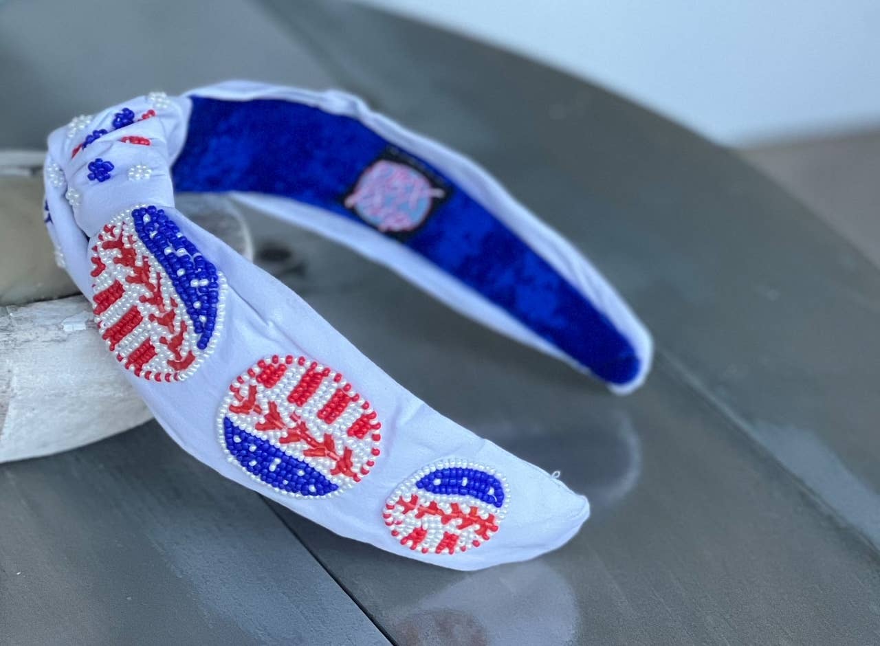White top knot headband featuring beaded patriotic baseballs.